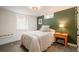Cozy bedroom with a comfortable bed, side table, and warm lighting at 9380 W 51St Ave, Arvada, CO 80002