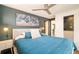 Cozy bedroom with stylish lighting, ceiling fan, and a neutral color palette creating a relaxing atmosphere at 9380 W 51St Ave, Arvada, CO 80002