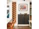 A dining area with a custom-built wine rack, cabinet, colorful artwork, and modern decor at 9380 W 51St Ave, Arvada, CO 80002