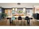 Bright dining area with modern lighting, hardwood floors, and an open layout at 9380 W 51St Ave, Arvada, CO 80002