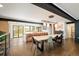 Spacious open-concept kitchen and dining area with modern design, island seating, and stainless steel appliances at 9380 W 51St Ave, Arvada, CO 80002
