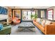 Bright living room featuring stylish furniture, hardwood floors, and large windows at 9380 W 51St Ave, Arvada, CO 80002