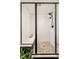 Beautiful walk-in shower featuring black hardware and unique stone flooring at 9380 W 51St Ave, Arvada, CO 80002