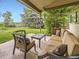 Relaxing covered patio with comfortable seating, perfect for outdoor entertaining or quiet relaxation at 3210 S Espana Cir, Aurora, CO 80013