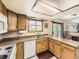 Functional kitchen featuring ample counter space, wooden cabinets, and updated appliances at 3210 S Espana Cir, Aurora, CO 80013