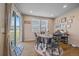 Charming dining area with sliding glass door, natural light, and stylish furnishings at 27185 E Costilla Dr, Aurora, CO 80016