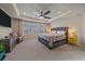 Spacious main bedroom featuring tray ceilings, a ceiling fan, and natural light at 27185 E Costilla Dr, Aurora, CO 80016