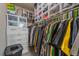 Well-organized walk-in closet featuring built-in shelving and ample storage for shoes and clothes at 27185 E Costilla Dr, Aurora, CO 80016