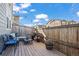 This backyard deck features a seating area, grill, and is ready for you to entertain outside at 13734 Ash Cir, Brighton, CO 80602