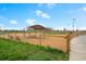 Fenced dog park provides a safe play area with seating and shade for community residents at 13734 Ash Cir, Brighton, CO 80602