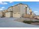 Exterior facade view of the townhome featuring a one car garage and tidy landscaping at 13734 Ash Cir, Brighton, CO 80602