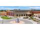 An exterior view of Trail Winds Recreation Center featuring an orange slide and modern architecture at 13734 Ash Cir, Brighton, CO 80602