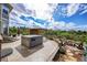 Spacious backyard with hot tub, gazebo, and seating area at 5965 Topaz Vista Pl, Castle Pines, CO 80108