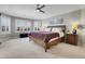 Bright bedroom with large windows and plantation shutters at 5965 Topaz Vista Pl, Castle Pines, CO 80108