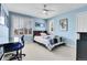 Bright bedroom with window shutters and a desk at 5965 Topaz Vista Pl, Castle Pines, CO 80108