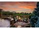 Fire pit and seating area with scenic sunset view at 5965 Topaz Vista Pl, Castle Pines, CO 80108