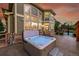 Hot tub on backyard patio with sunset view at 5965 Topaz Vista Pl, Castle Pines, CO 80108