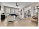 Bright and airy living room with hardwood floors and ample natural light at 5965 Topaz Vista Pl, Castle Pines, CO 80108