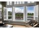 Open concept living area with window showcasing backyard patio and gazebo at 5965 Topaz Vista Pl, Castle Pines, CO 80108