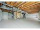 Unfinished basement with exposed wood ceiling and ductwork, offering potential for customization at 15904 W 58Th Ave, Golden, CO 80403
