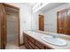 Bathroom with a double sink vanity and a view of the tub and shower at 15904 W 58Th Ave, Golden, CO 80403
