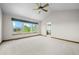 Large bedroom with vaulted ceilings and window overlooking a mountain view at 15904 W 58Th Ave, Golden, CO 80403