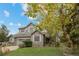 Beautiful home featuring stone accents, mature trees and a well-manicured lawn at 15904 W 58Th Ave, Golden, CO 80403