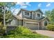 Charming exterior of a two-story home with a well-manicured lawn and established landscaping at 15904 W 58Th Ave, Golden, CO 80403