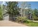 Two-story home with a spacious driveway and mature trees in a suburban neighborhood at 15904 W 58Th Ave, Golden, CO 80403