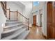 Bright and airy foyer featuring hardwood floors, a staircase and high ceilings at 15904 W 58Th Ave, Golden, CO 80403