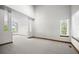 Spacious living room with tall ceilings, neutral paint, and large windows providing ample natural light at 15904 W 58Th Ave, Golden, CO 80403