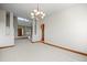 Spacious living room with high ceilings, large windows and an elegant chandelier at 15904 W 58Th Ave, Golden, CO 80403
