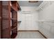 Walk-in closet with wire and wood shelving, and soft grey carpet at 15904 W 58Th Ave, Golden, CO 80403