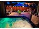Relaxing backyard with a hot tub, fire pit, outdoor kitchen, and dining area at 4779 S Bannock St, Englewood, CO 80110