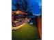 Backyard with outdoor kitchen, lawn, fire pit, bar and entertaining spaces at 4779 S Bannock St, Englewood, CO 80110