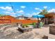 Backyard features a fire pit area, outdoor seating, and a covered outdoor kitchen at 4779 S Bannock St, Englewood, CO 80110