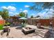 Backyard features firepit, patio, outdoor kitchen, seating and manicured landscaping at 4779 S Bannock St, Englewood, CO 80110