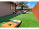Spacious backyard with patio, outdoor kitchen, firepit area, and lawn games at 4779 S Bannock St, Englewood, CO 80110