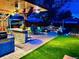 Spacious backyard with a patio, built-in grill, and multiple seating areas at 4779 S Bannock St, Englewood, CO 80110