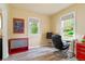 Bedroom features neutral walls, wood-look floors, and bright natural light at 4779 S Bannock St, Englewood, CO 80110