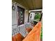 Welcoming front porch featuring a unique door design and comfortable seating at 4779 S Bannock St, Englewood, CO 80110