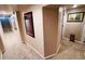 Hallway featuring neutral paint, carpet, and art at 4779 S Bannock St, Englewood, CO 80110