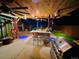 Outdoor kitchen features a bar, grill, ceiling fans and ample space for dining and entertaining at 4779 S Bannock St, Englewood, CO 80110