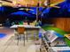 Enjoy outdoor living with an outdoor kitchen, bar, grill, ceiling fans and entertainment area at 4779 S Bannock St, Englewood, CO 80110