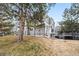 Gray townhome with steps leading to the entrance and landscaping at 6806 W 84Th Way # 4, Arvada, CO 80003