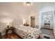 Comfortable bedroom with hardwood floors, a large window, and a walk-in closet at 2426 S Acoma St, Denver, CO 80223