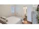 Cozy bedroom with a queen bed, neutral tones, and wood flooring at 2426 S Acoma St, Denver, CO 80223