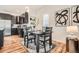Dining area showcases a wooden table set, modern art, and elegant decor at 2426 S Acoma St, Denver, CO 80223