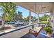 Relaxing front porch with a swing and a view of the street and neighborhood at 2426 S Acoma St, Denver, CO 80223
