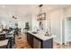 Stylish kitchen with a kitchen island overlooking the dining and living areas at 2426 S Acoma St, Denver, CO 80223